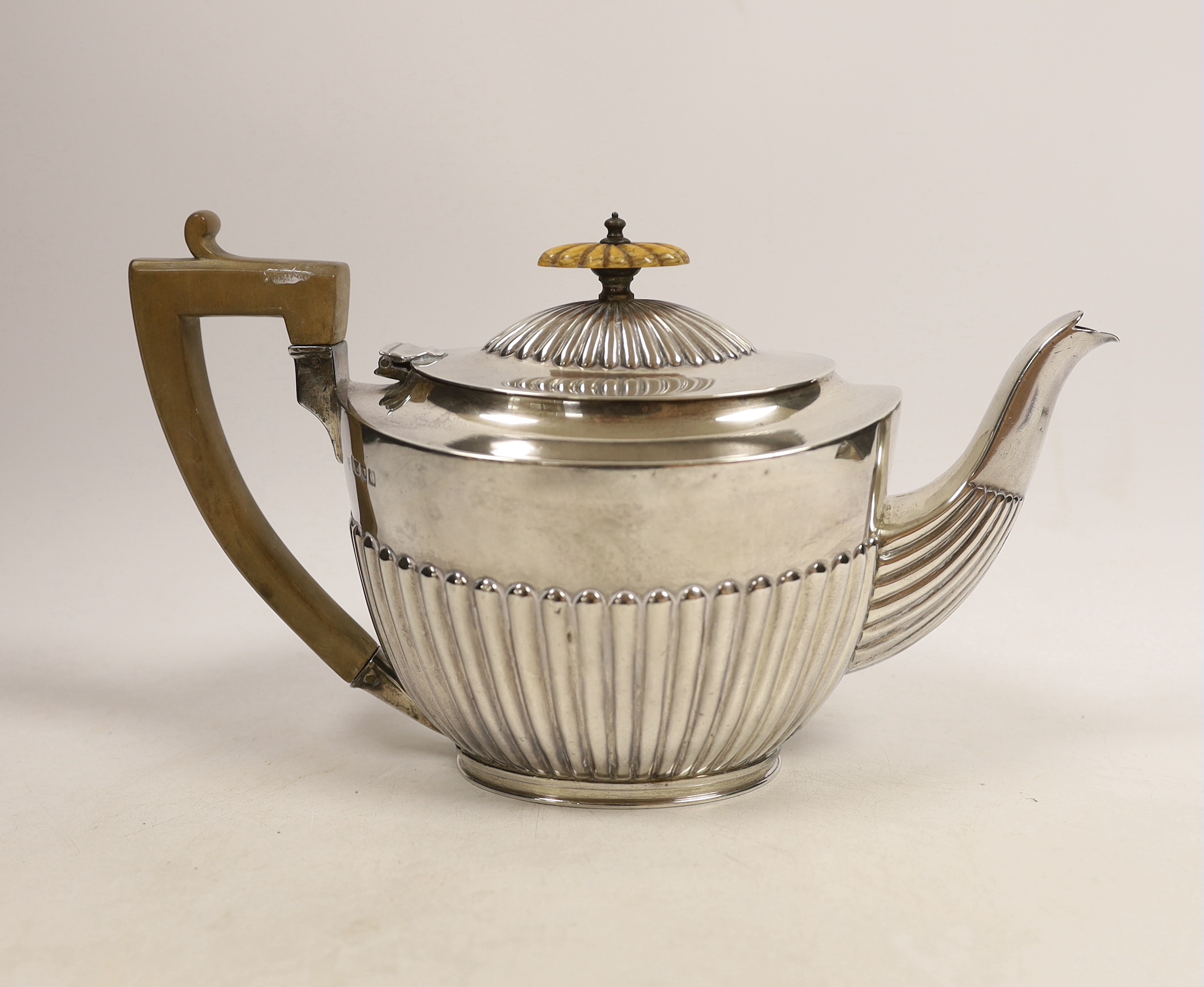 An Edwardian demi-fluted silver oval teapot, by Charles Stuart Harris, London, 1901, gross 16.5oz. CITES Submission reference WCCS1GJL